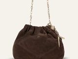 a brown sued bag with chain handles and a chain handle