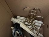 a cardboard box with a bunch of pens and pens in it