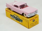 a pink toy car sitting on top of a yellow box