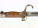 a knife with a wooden handle on a glass table