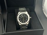 a black watch in a black box on a table