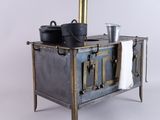 an old fashioned stove with pots and pans on it