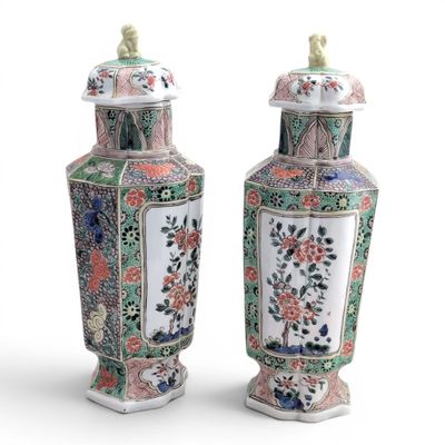 pair of chinese vases with flowers and birds painted on them
