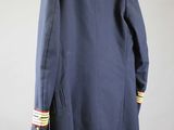 the back view of a blue jacket with a white shirt underneath it