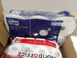 a box of toilet paper and two rolls of toilet paper