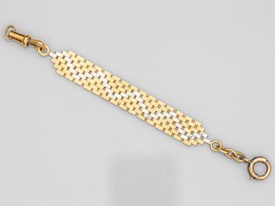 un bracelet en or et en argent muni d'un fermoir