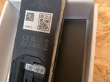 a box with a phone inside of it sitting on a table