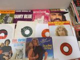 a lot of records and cds on the table