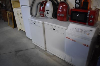 many appliances that are sitting on the counter in the garage