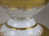 an image of a white and gold vase with a gold rim
