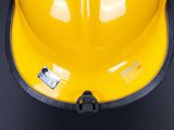 a yellow hard hat that is sitting on a table
