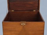 an old wooden box with a chain around it