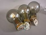 four light bulbs that are sitting on a table