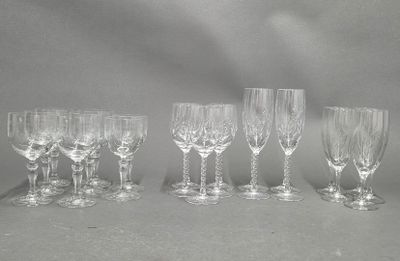 six wine glasses are lined up in a row on a table