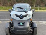 a small car that is parked on the side of the road