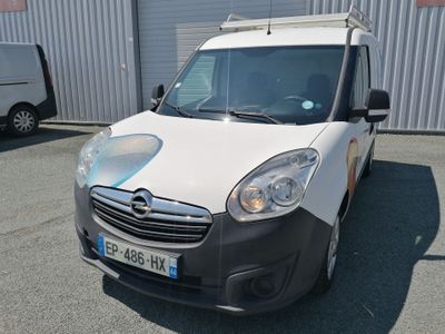 a white van parked in front of a building