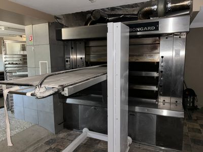 an image of a commercial kitchen with a conveyor belt