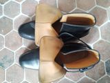a pair of shoes that are sitting on the floor