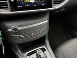 the interior of a car with a steering control and dashboard controls