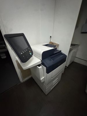 an image of a printer and a scanner in a room