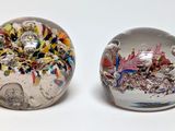 two marbles that are sitting next to each other