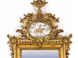 a gold frame with a picture of a horse on it