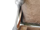four forks and spoons in a case on a table