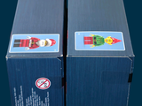 two boxes that are sitting side by side on a table