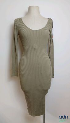 a dress on a mannequin stand with a white background