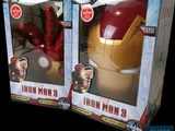 two boxes of iron man toys sitting side by side on a black background