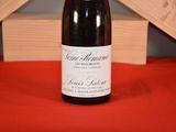a bottle of wine that is sitting on a table