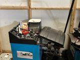 a blue machine that is sitting in the corner of a room