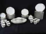 a lot of plates and cups and saucers on the table