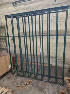 a large metal cage in the middle of a room