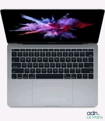 a close up of a laptop computer on a white surface