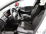 a picture of the inside of a car with a steering wheel