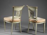 pair of chairs with upholstered backrests and upholstered seat
