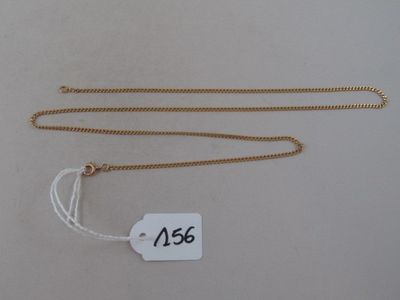 a close up of a gold chain with a price tag on it