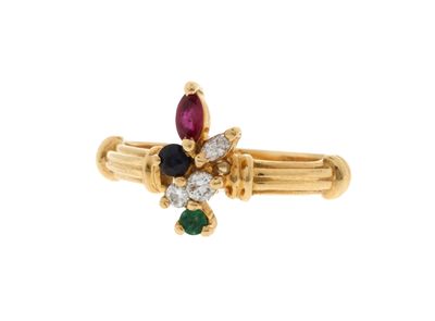 une image représentant une bague en or sertie de pierres multicolores