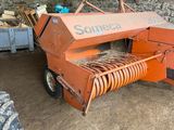 a close up of a machine that is sitting in the dirt