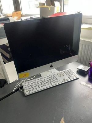 an image of a desk with a computer monitor and keyboard