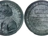 an old coin with a woman ' s face on it and a man ' s head on it