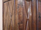 a wooden cabinet with a door on top of it
