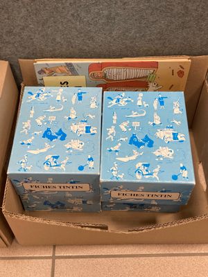 two boxes that are sitting in a box on the floor