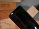 a bottle of wine that is sitting on a table