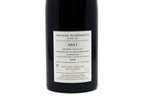 a bottle of wine that is sitting on a table