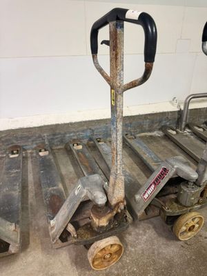 a small hand truck with a fork on the back