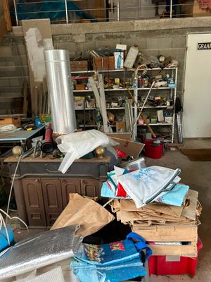 a room with a lot of clutter on the floor