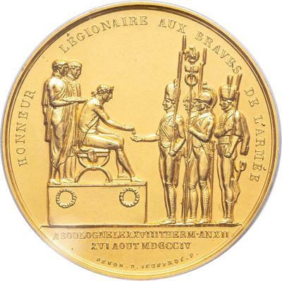 gold coin with a depiction of a man shaking hands with a woman