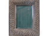 a picture of a picture frame on a white wall